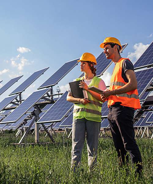 Engineers checking solar power farm