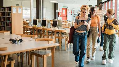 student leaving college library